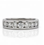 Platinum 1.11 Ct. D-Shape Anniversary Band: Sleek, modern anniversary wedding band structured in platinum featuring 1.11 carats of clean D-shape diamonds.