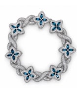 14K White Gold Topaz & Diamond Bracelet: High-end statement link bracelet designed in 14K white gold, set with bright blue topaz gems and fine diamond details.