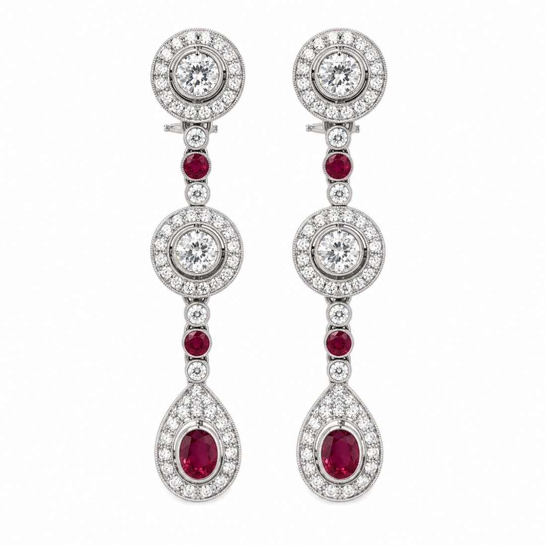 Platinum Deco-style Burma Ruby & Diamond Earrings: Geometric Deco-style drop earrings structured in platinum, featuring vibrant Burma rubies framed by fine white diamonds.