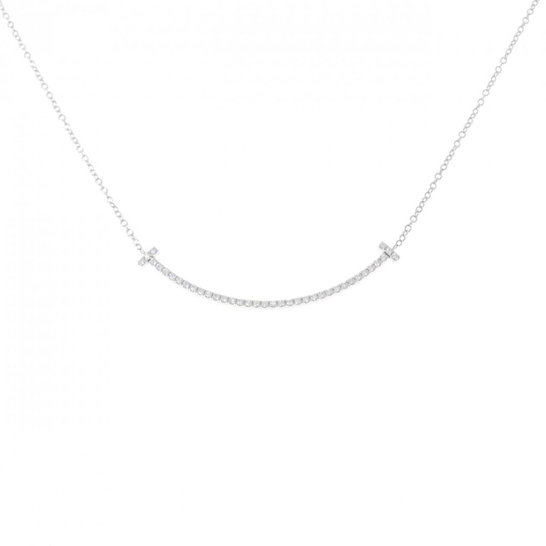 Tiffany T Smile Small Necklace: --- Catalog ---Category: SizeWeight: 2.2g / 0.07oz.Pendant Size: 3.5mm x 37mm / 0.13'' x 1.45''Neck Circumference: 42 cm / 16.53''Category: DesignMetal: White GoldStone: DiamondGender: WomenMetal Puri