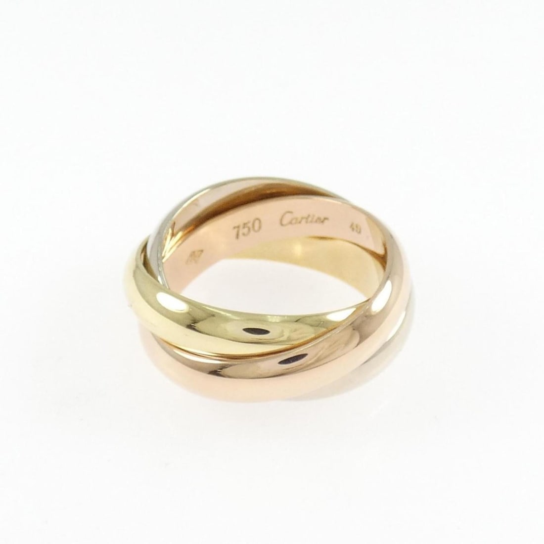 Cartier Trinity Ring: --- Catalog ---Category: SizeUS Size: 5Brand Size: 49Category: DesignType: Band ringGender: WomenMaterial: Pink gold (18K), White gold (18K), Yellow gold (18K)Category: GeneralMPN: 47059700Brand: Cart