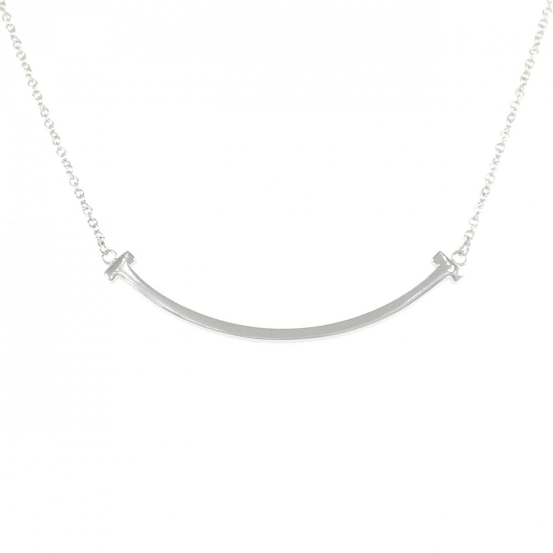 Tiffany T Smile Small Necklace: --- Catalog ---Category: SizeWeight: 3g / 0.1oz.Pendant Size: 3.5mm x 37.4mm / 0.13'' x 1.47''Neck Circumference: 41 cm - 46 cm / 16.14'' - 18.11''Category: DesignGender: WomenMaterial: White gold (18
