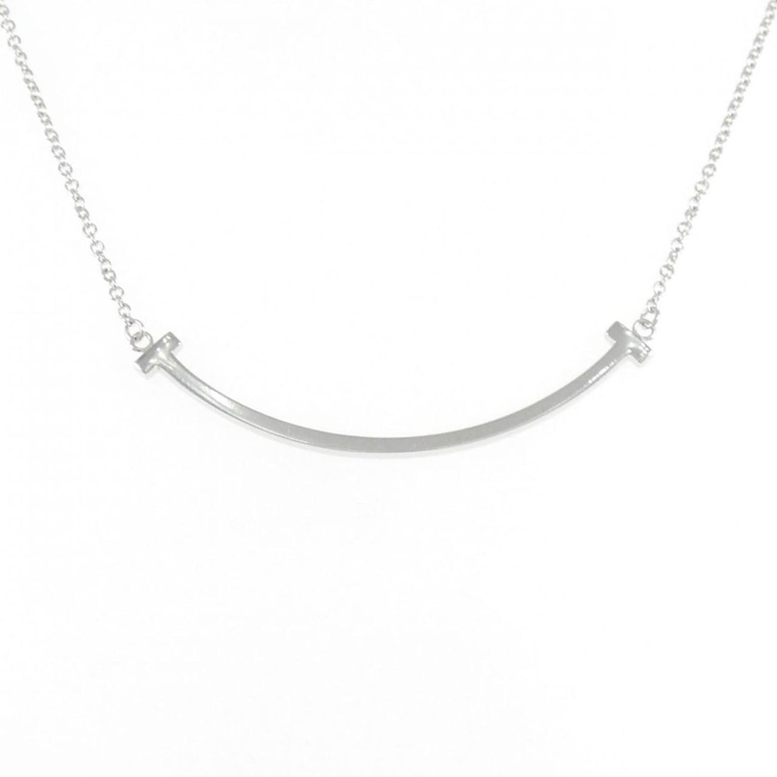 Tiffany T Smile Small Necklace: --- Catalog ---Category: SizePendant Size: 3.7mm x 37.6mm / 0.14'' x 1.48''Neck Circumference: 40 cm - 46 cm / 15.74'' - 18.11''Category: DesignColor: White goldGender: WomenMaterial: White gold (18K)