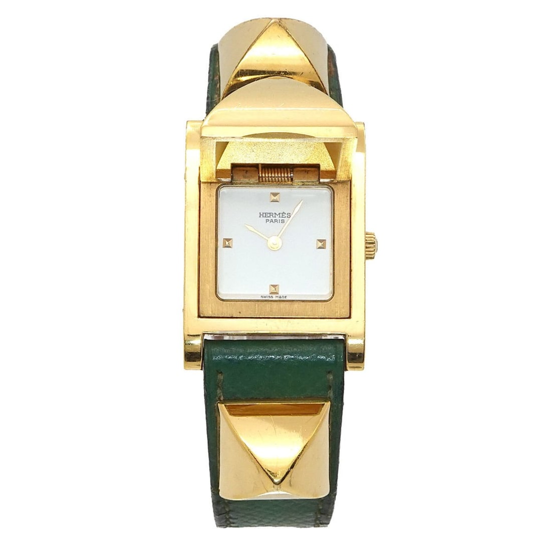 Hermes Medor Women's Watch, Pyramid Design, Gold Studs, White and Green Leather Strap, Quartz: --- Catalog ---Category: SizeWrist Size: 14cm - 16.5cm / 5.51'' - 6.49''Case Diameter: 23mm / 0.91''Category: DesignType: WristwatchGender: WomenColor (Dial): WhiteMaterial (Band): Gold plated, Leathe