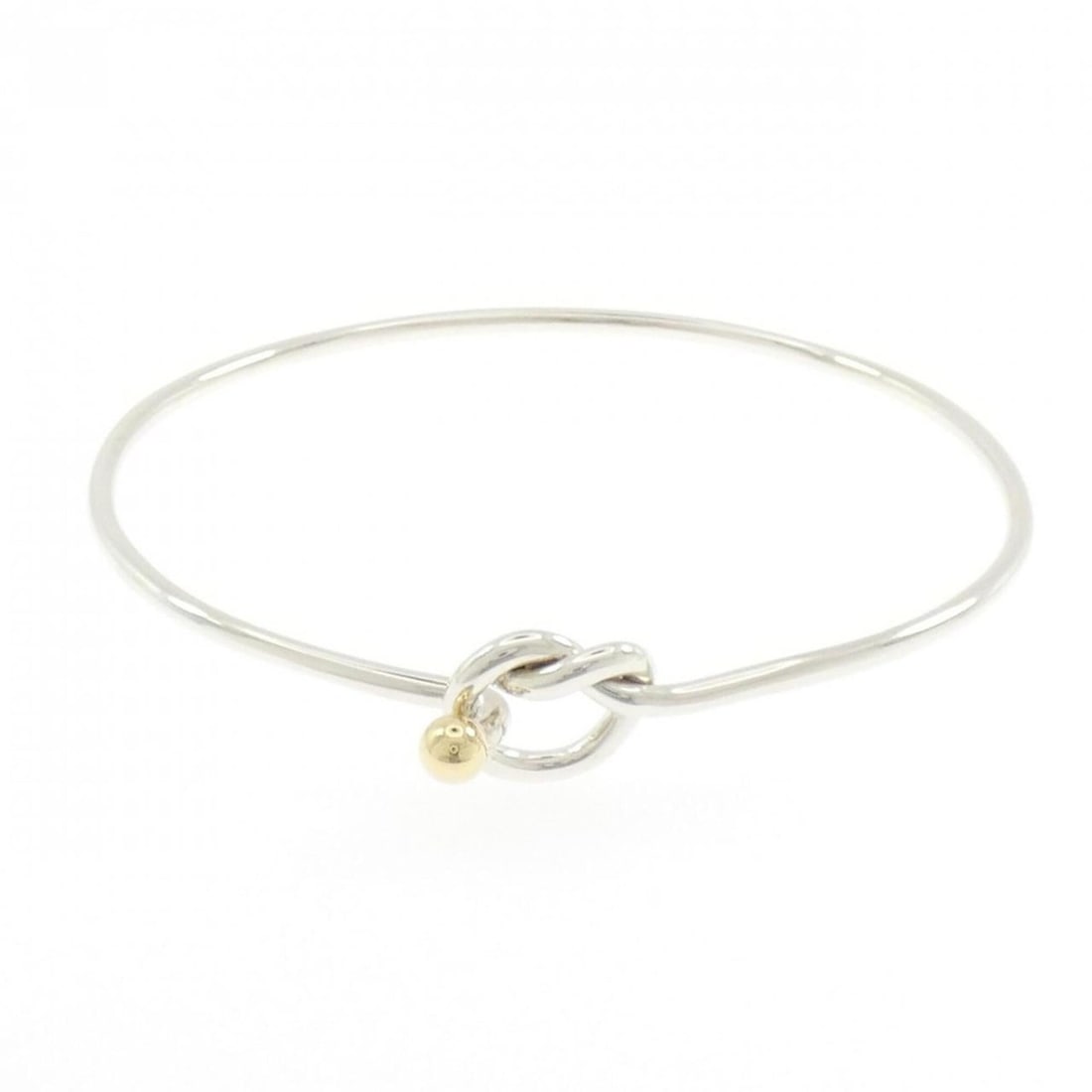 Tiffany & Co. Flat Wire Hook Eye Heart Bangle: --- Catalog ---Category: SizeLength: 17cm / 6.69''Category: DesignType: BangleGender: WomenMaterial: Silver 925, Yellow gold (18K)Category: GeneralBrand: Tiffany--- Item List ---Section:
