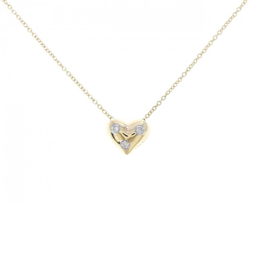 Tiffany Dots Pinched Heart Necklace: --- Catalog ---Category: SizePendant Size: 8.2mm x 9.9mm / 0.32'' x 0.38''Neck Circumference: 41 cm / 16.14''Category: DesignGender: WomenMaterial: Platinum 950, Yellow gold (18K)Pendant Type: