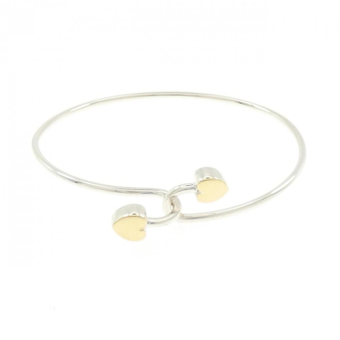 Tiffany Solid Double Heart Bangle: --- Catalog ---Category: SizeLength: 17.5cm / 6.88''Category: DesignType: BangleGender: WomenMaterial: Silver 925, Yellow gold (18K)Category: GeneralBrand: Tiffany--- Item List ---Section: