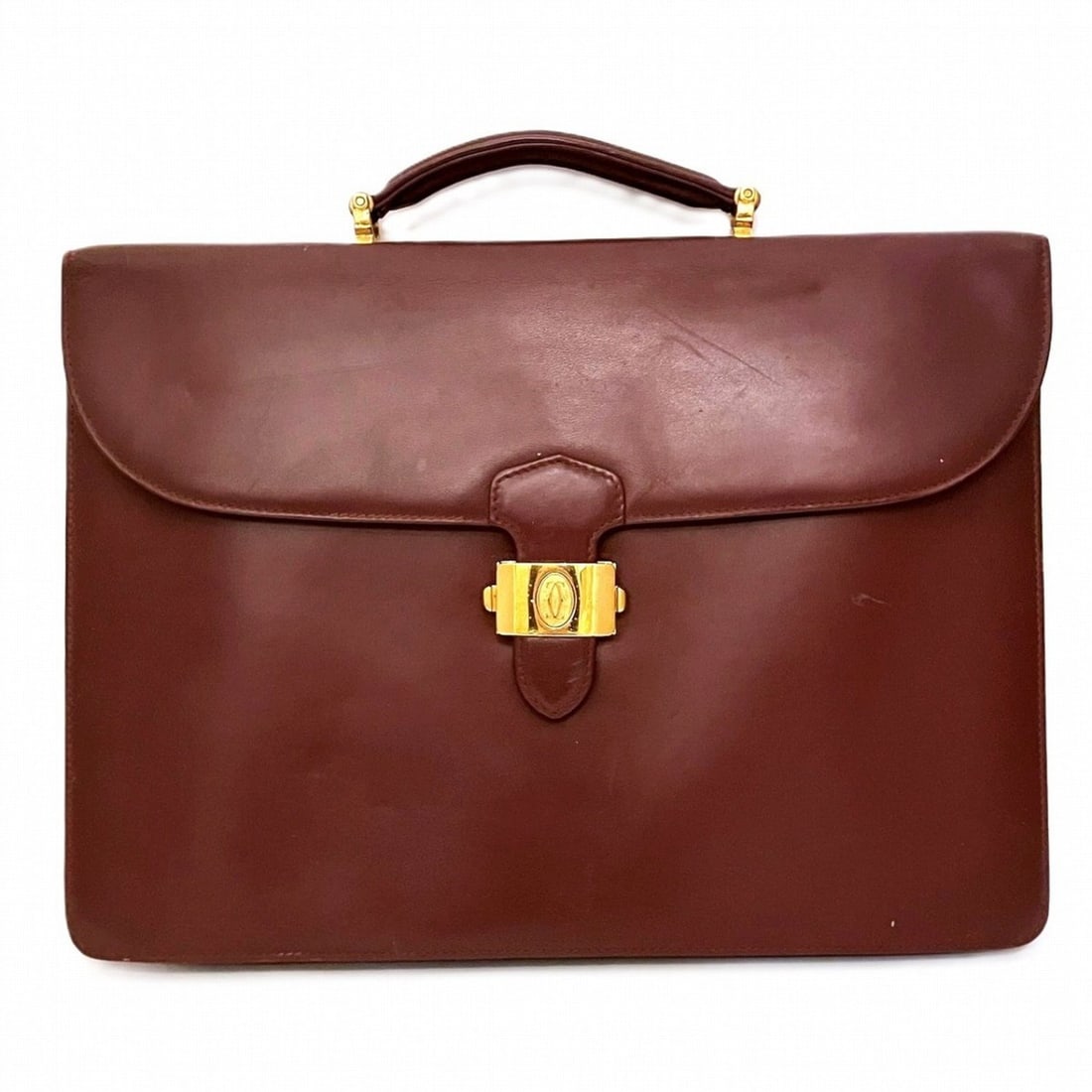 Cartier business bag, Must line, leather.: --- Catalog ---Category: SizeHandle Drop: 4.50cm / 1.77''Size (HxWxD): 27.5cm x 38cm x 3cm / 10.82'' x 14.96'' x 1.18''Handle Length: 20cm / 7.87''Category: DesignType: BriefcaseColor: Wine