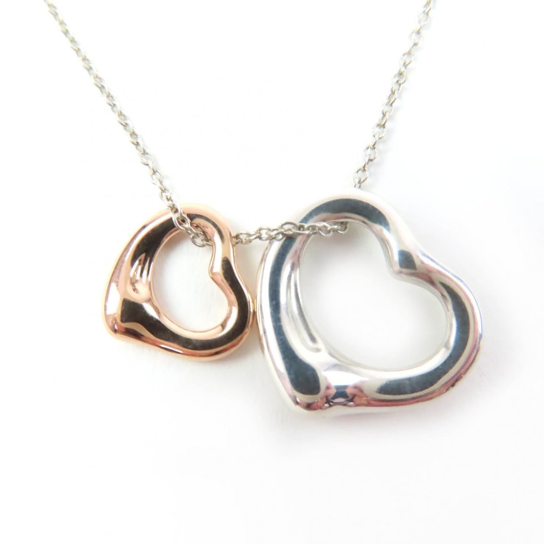 TIFFANY&Co. Tiffany Elsa Peretti Open Heart Pendant AG925 750 (18KPG) Combination Silver and Rose: --- Catalog ---Category: SizePendant Size: 15mm x 13mm / 0.59'' x 0.51''Neck Circumference: 42 cm / 16.53''Category: DesignColor: Rose gold, SilverGender: WomenMaterial: Rose gold (18K), Silver 925Pen