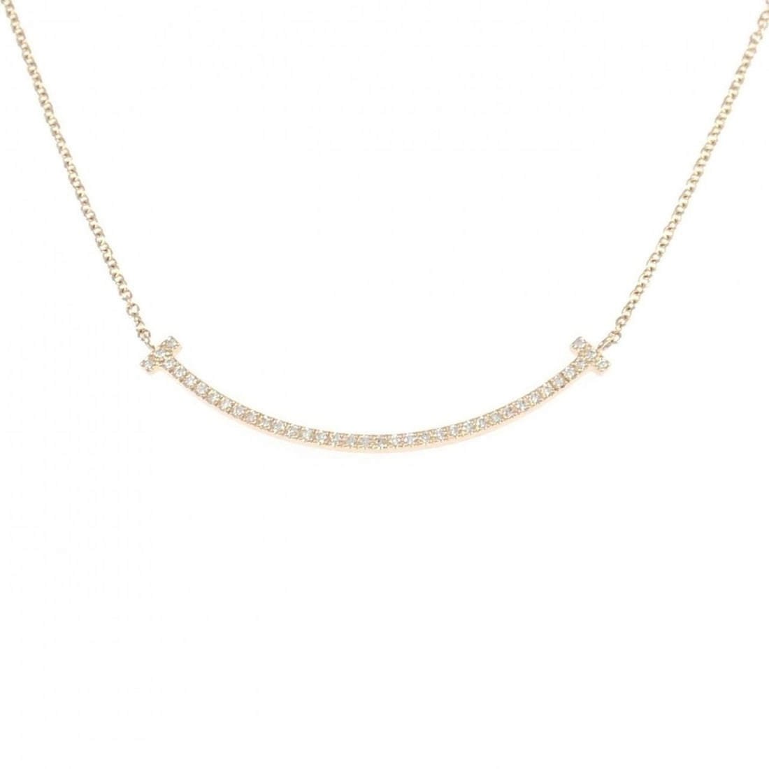 Tiffany T Smile Small Necklace: --- Catalog ---Category: SizePendant Size: 3.5mm x 37.3mm / 0.13'' x 1.46''Neck Circumference: 50 cm / 19.68''Category: DesignStone: DiamondGender: Men,WomenMaterial: Pink gold (18K)Pendant Type: