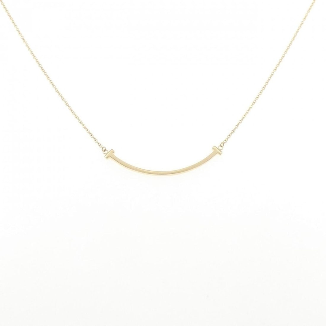 Tiffany T Smile Small Necklace: --- Catalog ---Category: SizeWeight: 2.8g / 0.09oz.Pendant Size: 3.6mm x 37mm / 0.14'' x 1.45''Neck Circumference: 41 cm - 46 cm / 16.14'' - 18.11''Category: DesignColor: YellowMetal: GoldGender: