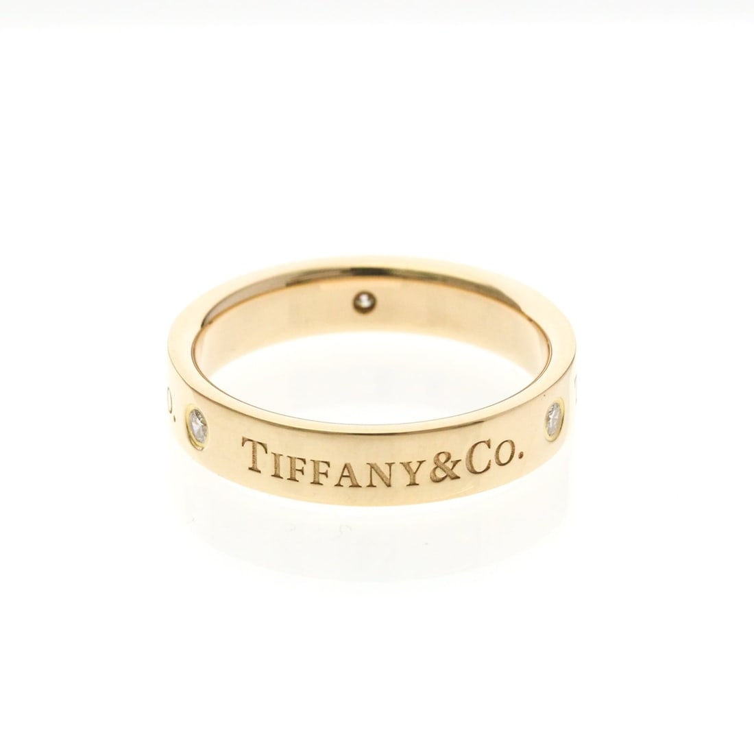 TIFFANY Flat Band Ring With 3 Diamonds Pink Gold (18K) Polished: --- Catalog ---Category: SizeWidth: 4.1mm / 0.16''Weight: 5.1g / 0.17oz.JP Size: 12US Size: 6-6.5Category: DesignType: Band ringColor: Pink goldMetal: GoldStone: DiamondStyle: FashionGender: Men,Women