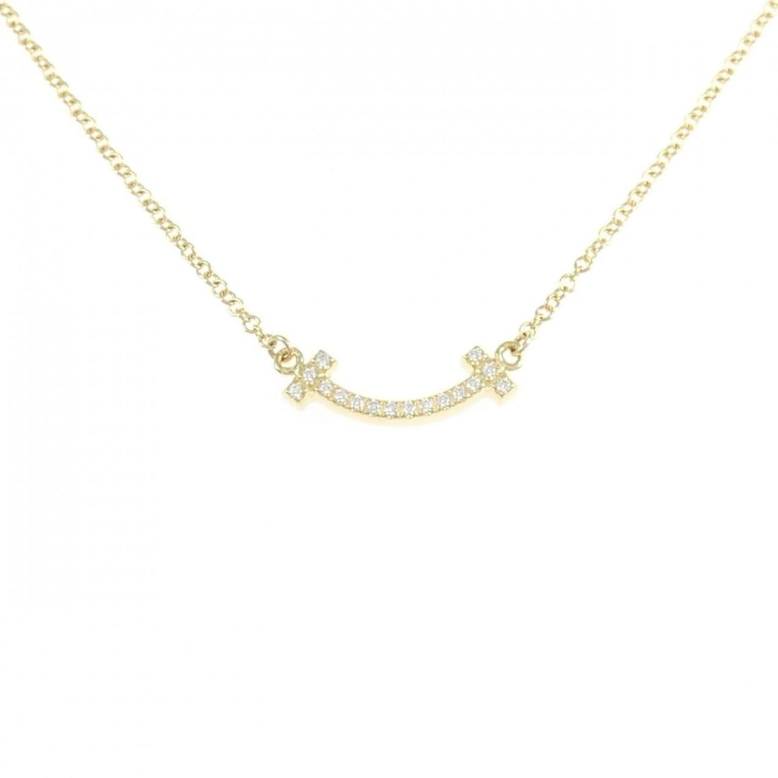 Tiffany T Smile Mini Necklace: --- Catalog ---Category: SizePendant Size: 3.6mm x 14.5mm / 0.14'' x 0.57''Neck Circumference: 46 cm / 18.11''Category: DesignColor: Yellow goldGender: WomenMaterial: Yellow gold (18K)Pendant Type: