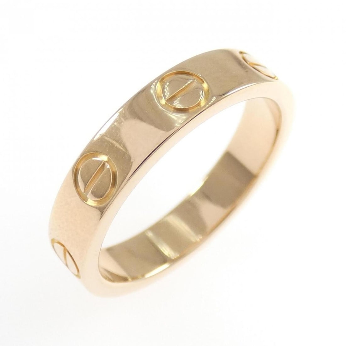 Cartier Mini Love Ring: --- Catalog ---Category: SizeWidth: 3.4mm / 0.13''Weight: 3.5g / 0.12oz.JP Size: 7US Size: 4Category: DesignType: Band ringGender: WomenMaterial: Pink gold (18K)Category: GeneralLine: LoveBrand: