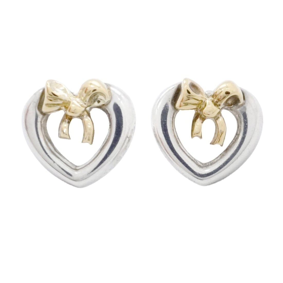 Tiffany & Co. Heart Ribbon Earrings, 18K Yellow Gold (KYG), Sterling Silver (925), Women's: --- Catalog ---Category: SizeSize (HxWxD): 10.60mm x 11.30mm / 0.42'' x 0.44''Category: DesignType: Stud earringsGender: WomenMaterial: Silver 925, Yellow gold (18K)Category: GeneralBrand: Tiffany--- 
