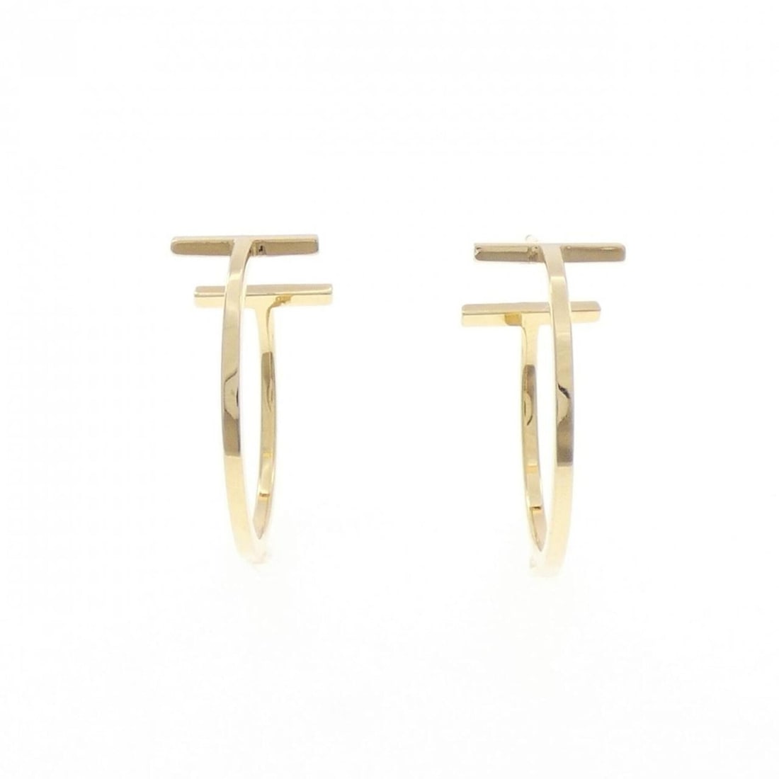 Tiffany & Co. T Wire Hoop Medium Earrings: --- Catalog ---Category: SizeWeight: 4.7g / 0.16oz.Size (HxWxD): 22.70mm x 10.30mm / 0.89'' x 0.41''Category: DesignType: Clip earringsGender: WomenMaterial: Yellow gold (18K)Category: GeneralLine: