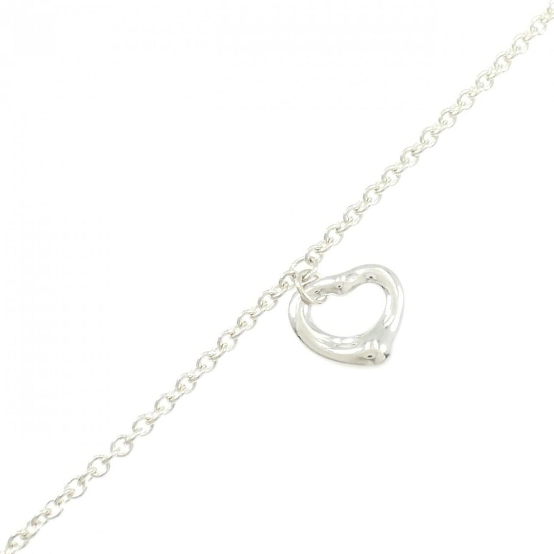 Tiffany Open Heart Bracelet: --- Catalog ---Category: SizeWidth: 1.36cm / 0.53''Weight: 2.6g / 0.09oz.Total Length: 18.5cm / 7.28''Category: DesignType: Charm braceletGender: WomenMaterial: Silver 925Category: GeneralLine: Open H
