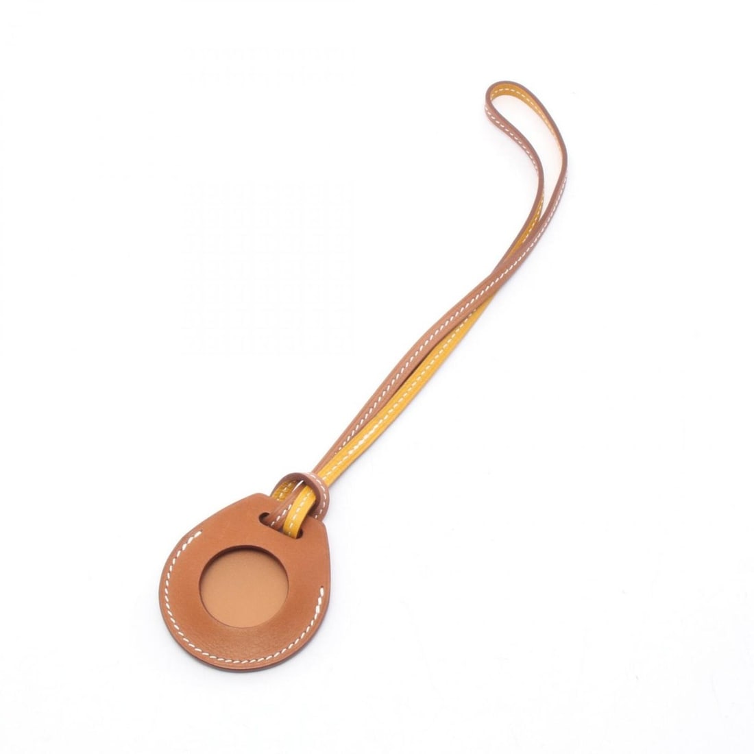 Hermes Apple AirTag, Gold Jaune d'Or Charm, Accessory, Veau Swift Leather, Men's & Women's, Brown: --- Catalog ---Category: DesignType: Handbag charmColor: Brown, YellowGender: Men,WomenMaterial: Swift leatherCategory: GeneralBrand: Hermes--- Item List ---Section: ConditionRanking: Rank A Used - A 