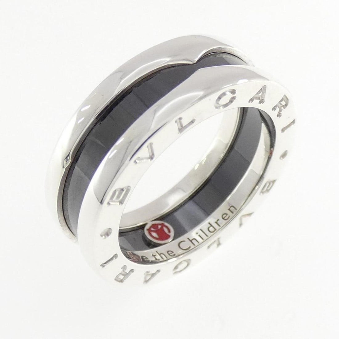 Bvlgari Save the Children Ring: --- Catalog ---Category: SizeJP Size: 8US Size: 4.5Category: DesignType: Band ringGender: WomenMaterial: Ceramic, Silver 925Category: GeneralBrand: Bvlgari--- Item List ---Section: ConditionRanking: R