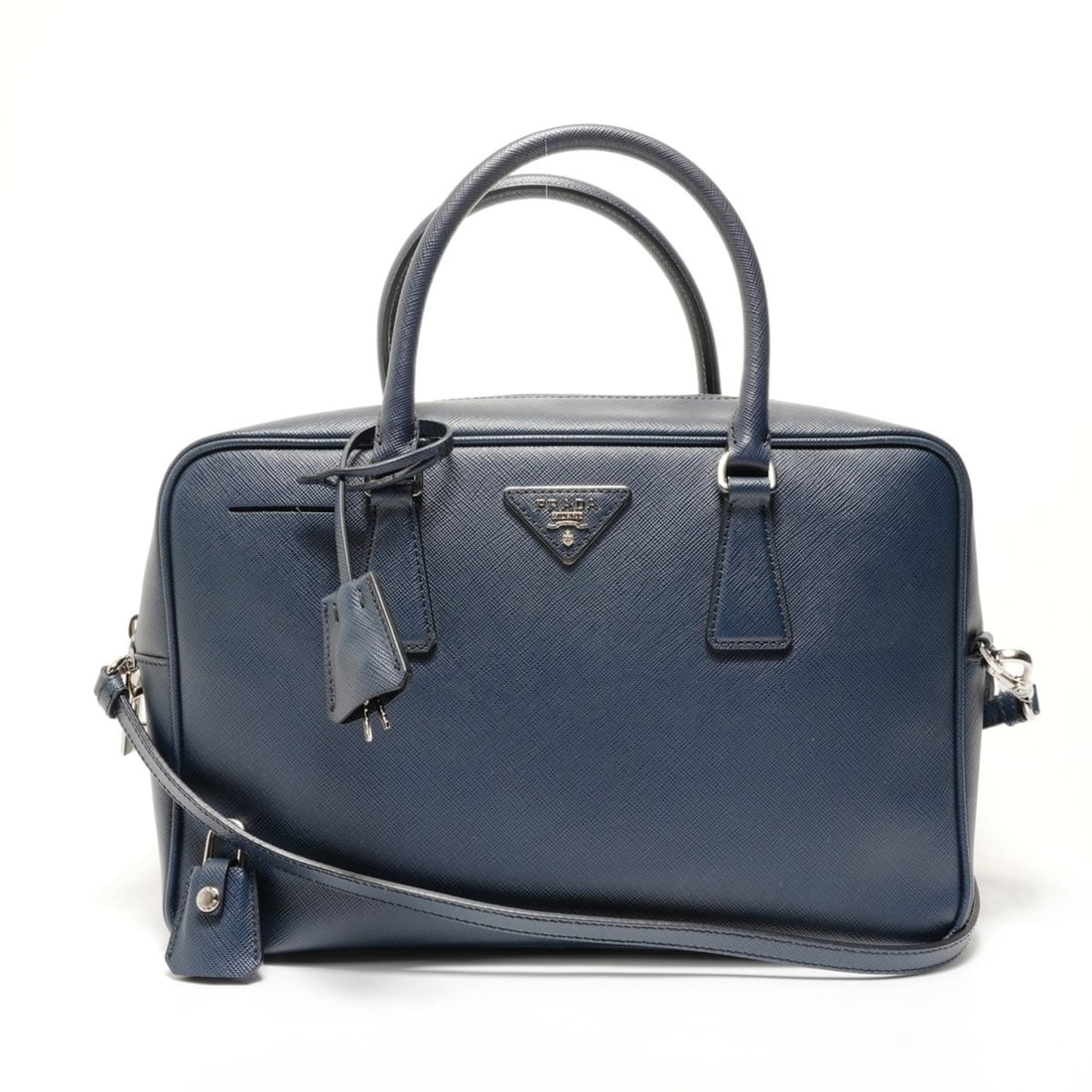 Prada Saffiano 2-Way Handbag 1BB095 Navy: --- Catalog ---Category: SizeHandle Drop: 11.00cm / 4.33''Size (HxWxD): 20cm x 30cm x 9cm / 7.87'' x 11.81'' x 3.54''Strap Length: 125cm - 135cm / 49.21'' - 53.14''Category: DesignType: HandbagColor: 