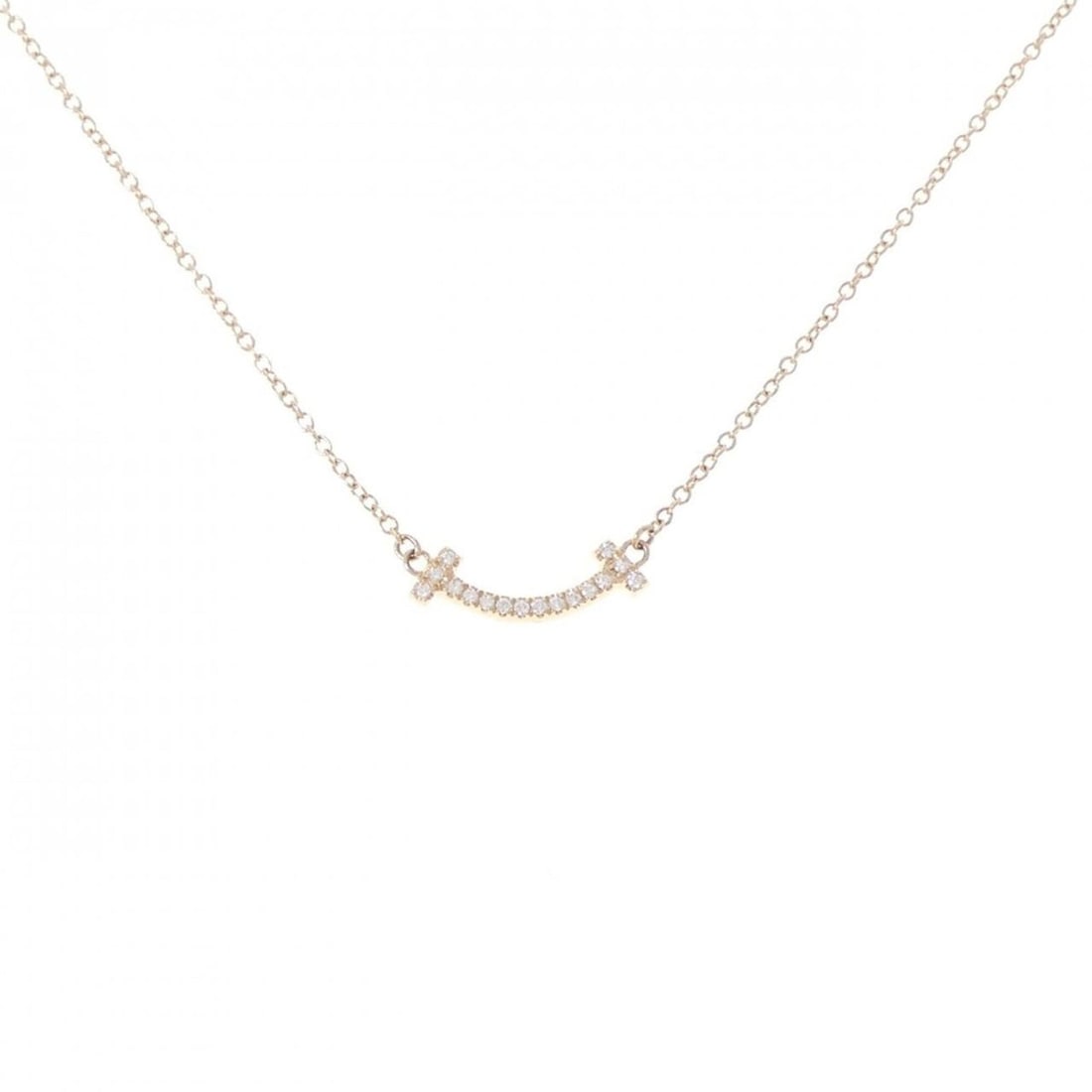 Tiffany T Smile Mini Necklace: --- Catalog ---Category: SizePendant Size: 4.4mm x 13.4mm / 0.17'' x 0.52''Neck Circumference: 41 cm - 46 cm / 16.14'' - 18.11''Category: DesignStone: DiamondGender: WomenMaterial: Pink gold
