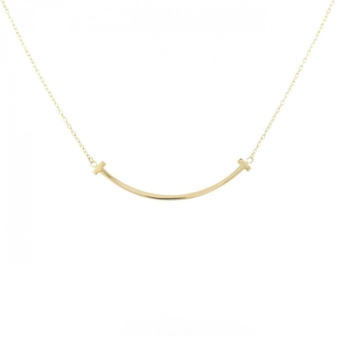 Tiffany T Smile Small Necklace: --- Catalog ---Category: SizePendant Size: 3.7mm x 36.8mm / 0.14'' x 1.44''Neck Circumference: 42 cm - 45 cm / 16.53'' - 17.71''Category: DesignGender: WomenMaterial: Yellow gold (18K)Pendant Type: