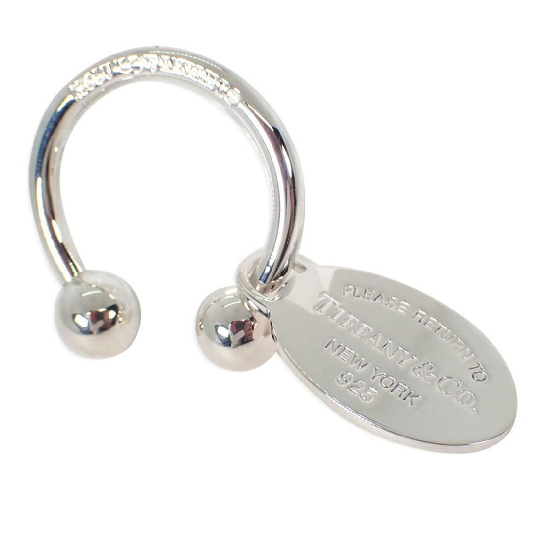 TIFFANY & Co. 925 Return to Tiffany Oval Tag Keyring: --- Catalog ---Category: DesignType: KeyringGender: WomenMaterial: Sterling silver 925Category: GeneralBrand: Tiffany--- Item List ---Section: ConditionRanking: Rank A Used - A few traces of usage, so