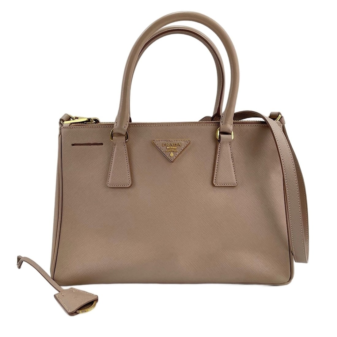 Prada Galleria 2-Way Handbag, Pink: --- Catalog ---Category: SizeSize (HxWxD): 20cm x 30cm x 12cm / 7.87'' x 11.81'' x 4.72''Category: DesignType: HandbagColor: PinkGender: WomenCategory: GeneralBrand: PradaCountry of Origin: Italy--- I
