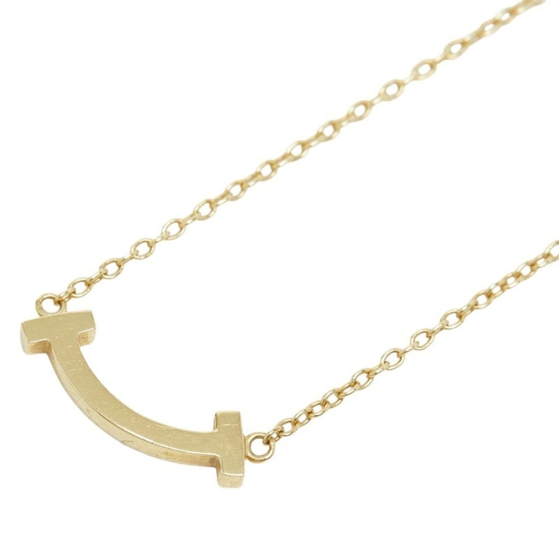 Tiffany & Co. T Smile Mini Necklace, 18K Yellow Gold, Women's.: --- Catalog ---Category: SizeNeck Circumference: 55 cm / 21.65''Category: DesignColor: YellowGender: WomenMaterial: Yellow gold (18K)Necklace Type: NecklaceCategory: GeneralBrand: Tiffany--- Item List