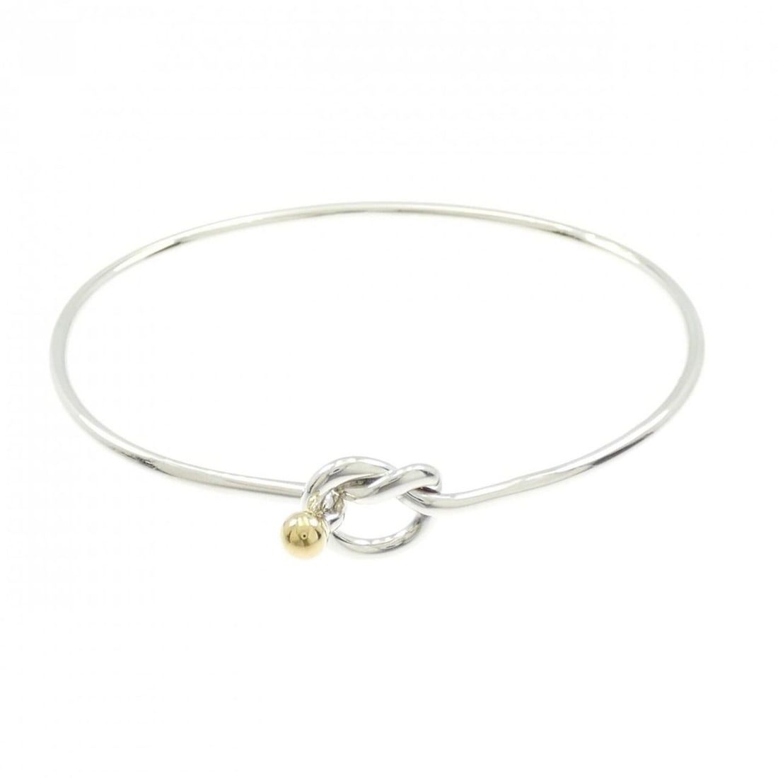 Tiffany & Co. 925 750YG Bangle: --- Catalog ---Category: SizeLength: 17cm / 6.69''Category: DesignType: BangleColor: Silver, Yellow goldGender: WomenMaterial: Silver 925, Yellow gold (18K)Category: GeneralBrand: Tiffany--- Item List
