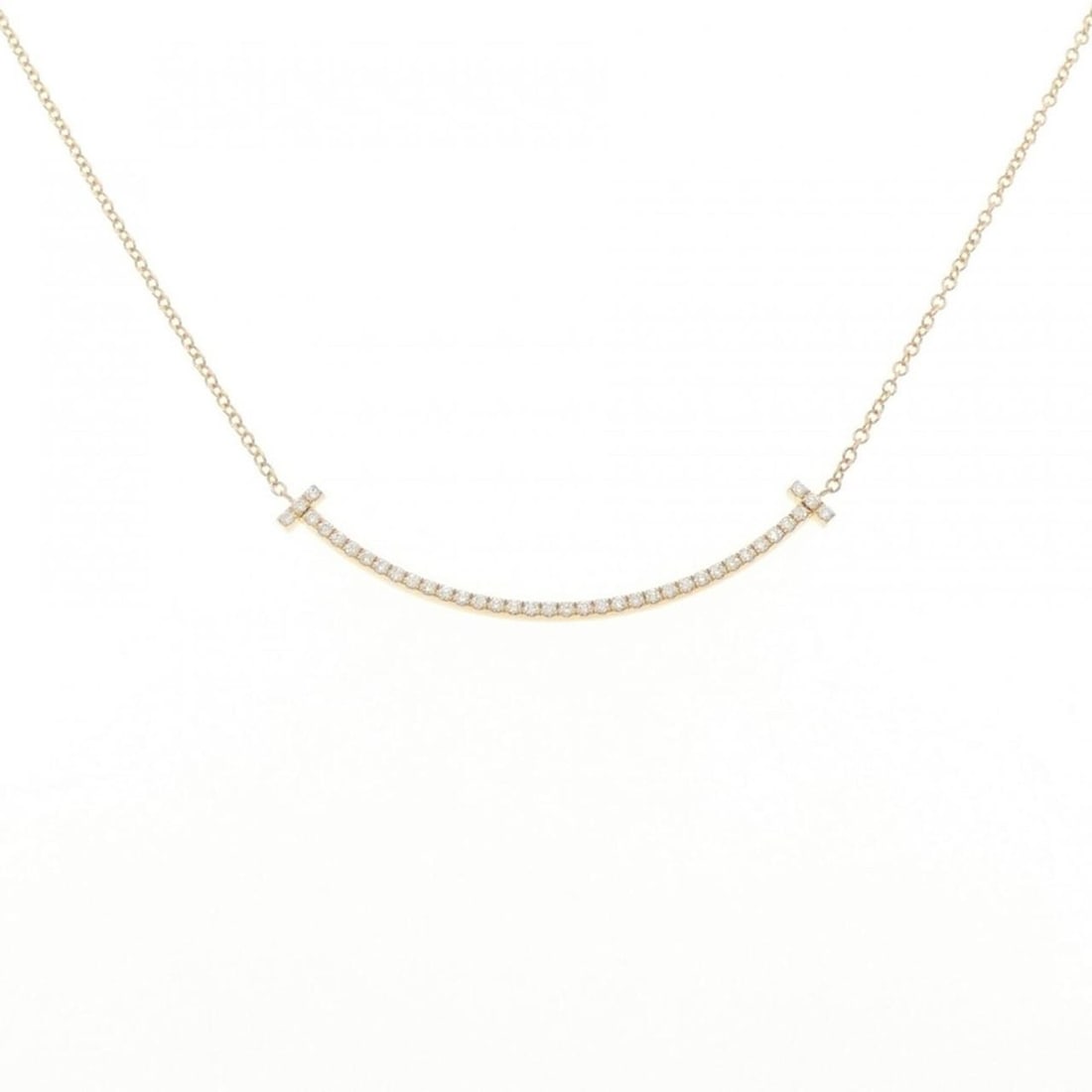Tiffany T Smile Small Necklace: --- Catalog ---Category: SizePendant Size: 3.5mm x 37.1mm / 0.13'' x 1.46''Neck Circumference: 41 cm / 16.14''Category: DesignColor: Yellow goldStone: DiamondGender: WomenMaterial: Yellow gold
