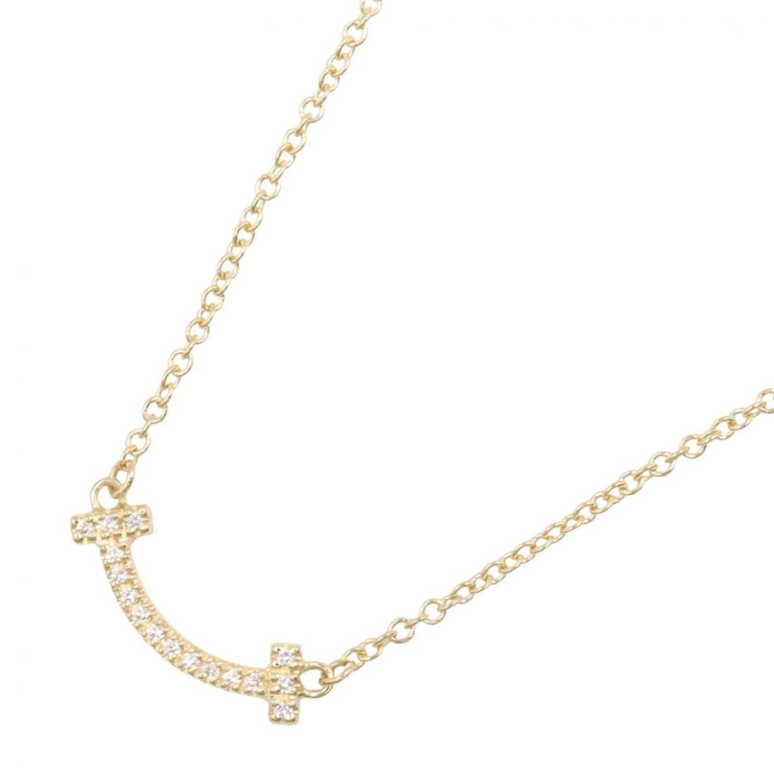 Tiffany & Co. T Smile Mini Diamond Necklace, 18K (Yellow Gold), Diamond, Women's, Gold Tone, Clear: --- Catalog ---Category: SizePendant Size: 4mm x 13mm / 0.15'' x 0.51''Neck Circumference: 40.5 cm - 45.5 cm / 15.94'' - 17.91''Category: DesignColor: Clear, GoldGender: WomenMaterial: Yellow gold (18