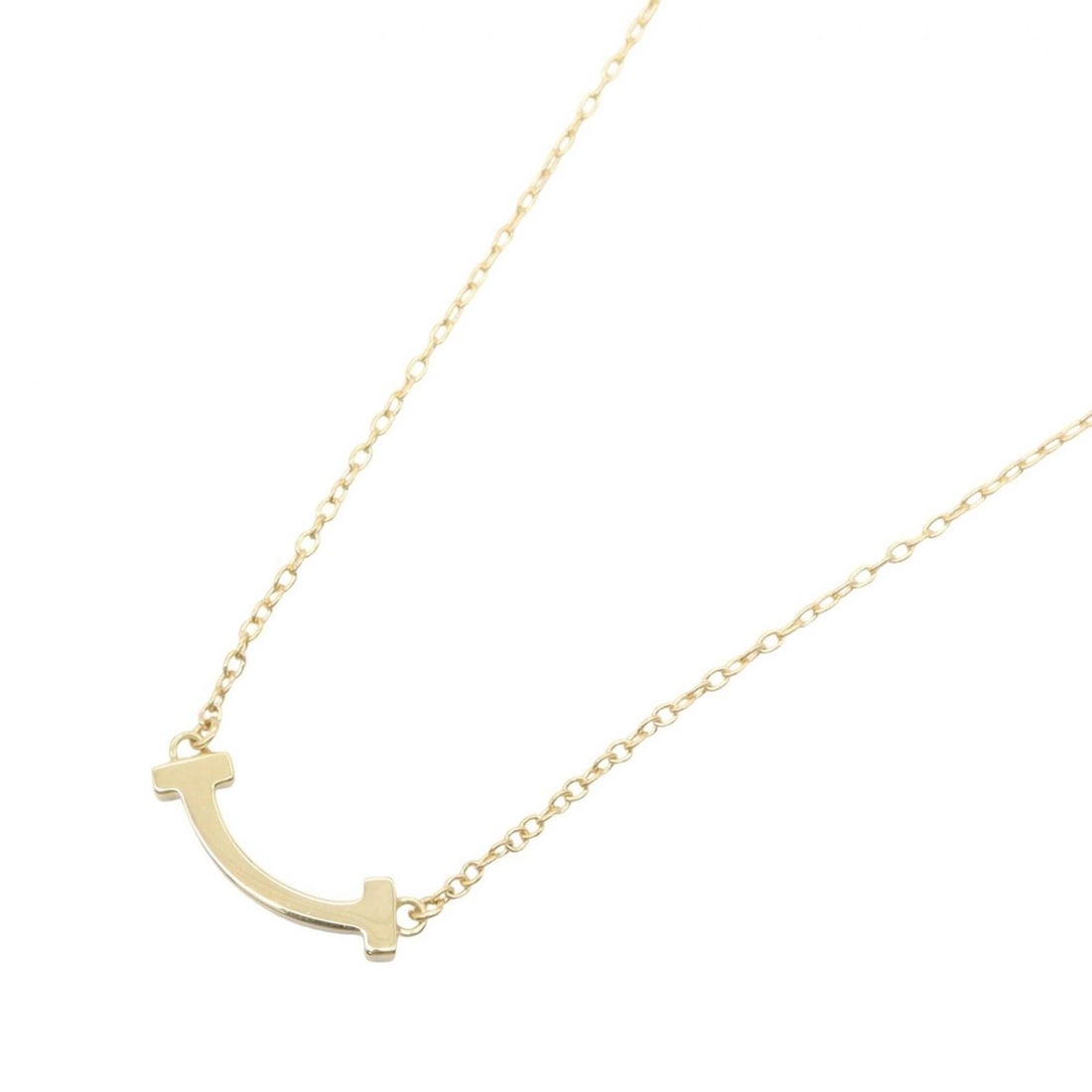 Tiffany & Co. T Smile Mini Necklace, 18K (Yellow Gold), Women's, Gold Tone, 62617640: --- Catalog ---Category: SizePendant Size: 3mm x 13mm / 0.11'' x 0.51''Neck Circumference: 52 cm - 56.5 cm / 20.47'' - 22.24''Category: DesignColor: GoldGender: WomenMaterial: Yellow gold (18K)Necklac