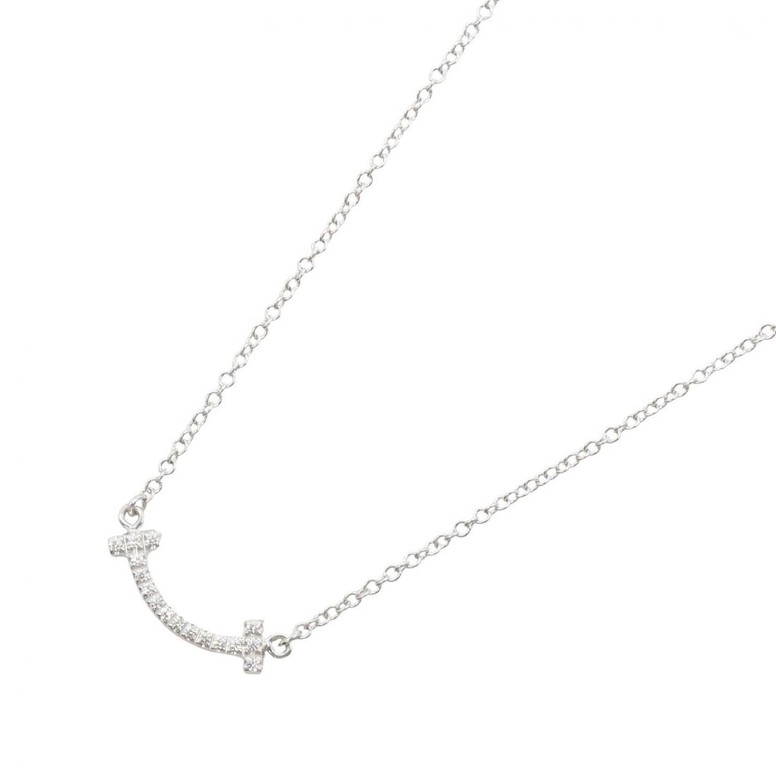Tiffany & Co. T Smile Mini Diamond Necklace, 18K White Gold (18KWG), Diamond, Women's, Silver/Clear: --- Catalog ---Category: SizePendant Size: 3mm x 13mm / 0.11'' x 0.51''Neck Circumference: 40.5 cm - 45.5 cm / 15.94'' - 17.91''Category: DesignColor: Clear, SilverGender: WomenMaterial: White gold (1