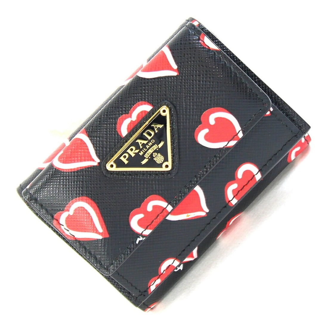 Prada Tri-fold Wallet 1MH021 Black Red Compact Mini Heart Design Women's PRADA: --- Catalog ---Category: SizeSize (HxWxD): 7cm x 9.5cm x 3.5cm / 2.75'' x 3.74'' x 1.37''Category: DesignType: Wallet (tri-fold)Color: Black, Red colorGender: WomenMaterial: Leather Category: GeneralB