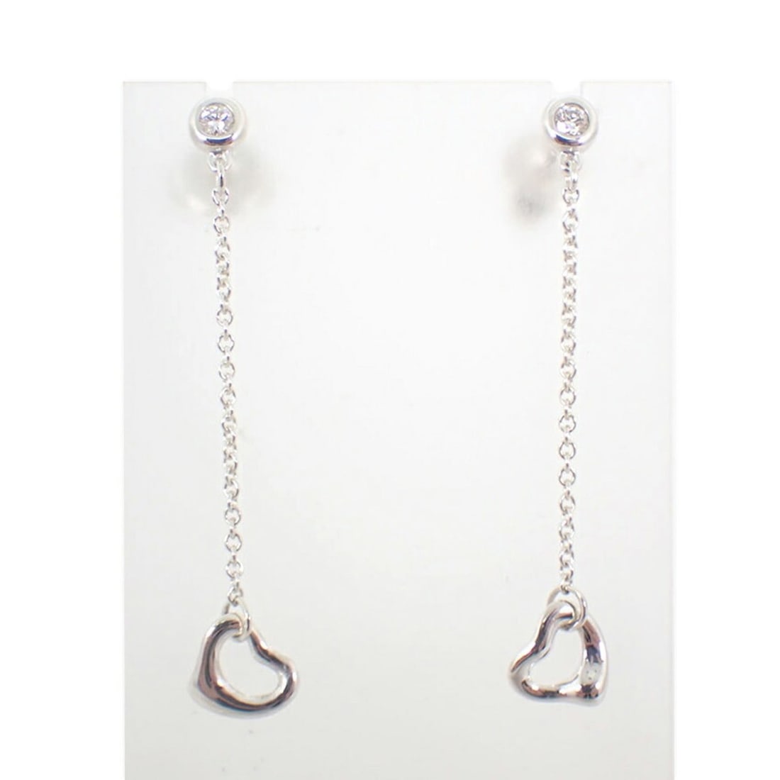 TIFFANY & Co. 925 By the Yard Diamond 2pc Heart Earrings: --- Catalog ---Category: SizeSize (HxWxD): 38.00mm x 6.70mm / 1.50'' x 0.26''Category: DesignType: Drop earringsGender: WomenMaterial: Sterling silver 925Category: GeneralBrand: Tiffany--- Item List -