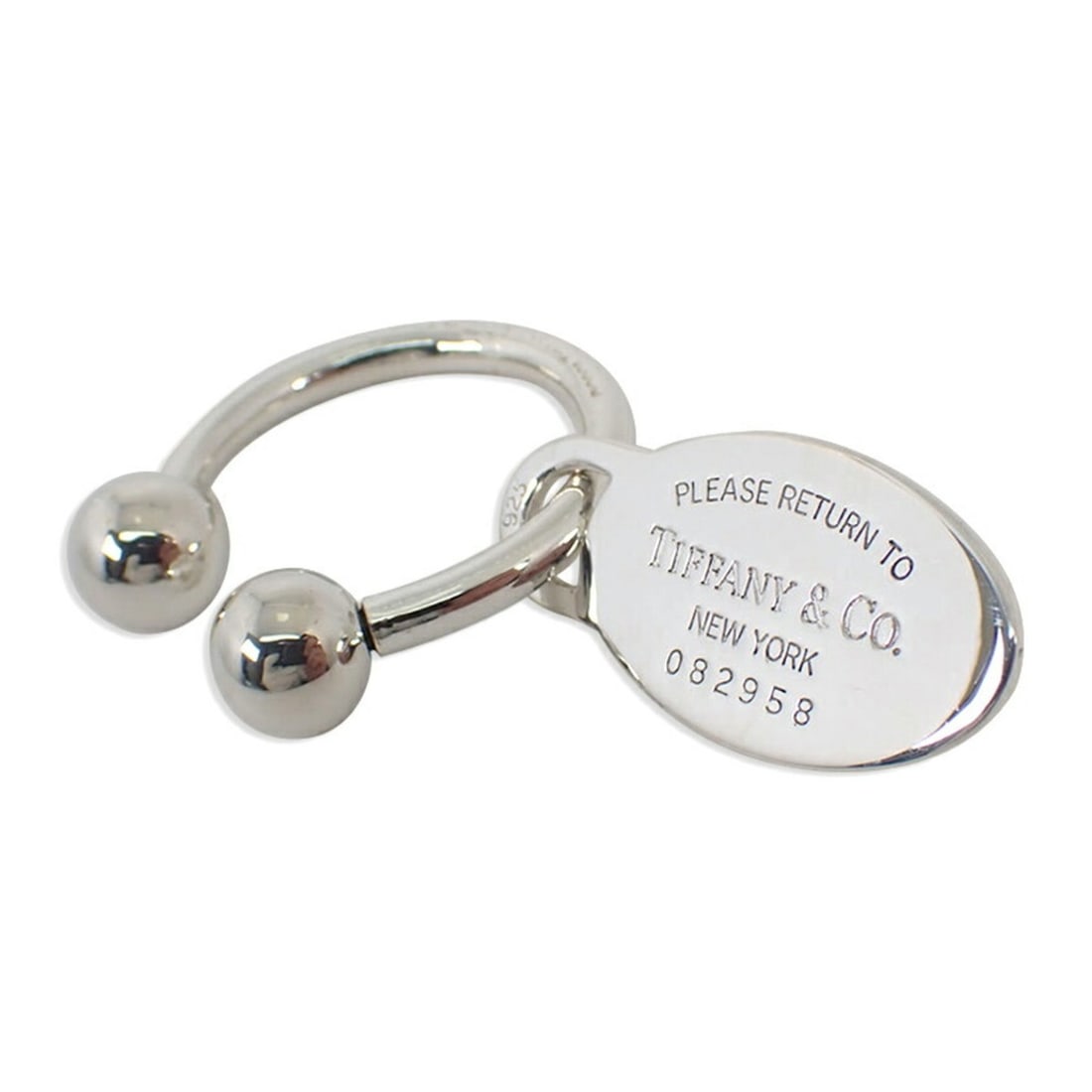 TIFFANY & Co. 925 Return to Tiffany Oval Tag Keyring: --- Catalog ---Category: DesignType: KeyringGender: Men,WomenMaterial: Sterling silver 925Category: GeneralBrand: Tiffany--- Item List ---Section: ConditionRanking: Rank SA Used - Hardly any traces