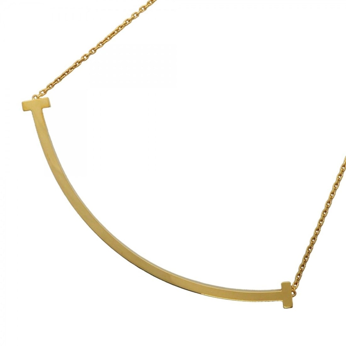 Tiffany & Co. T Smile Extra Large 18K Yellow Gold Necklace (Men's Women's): --- Catalog ---Category: SizePendant Size: 20.2mm x 83.8mm / 0.79'' x 3.29''Neck Circumference: 40.5 cm - 45.5 cm / 15.94'' - 17.91''Category: DesignGender: Men,WomenMaterial: Yellow gold (18K)Necklac