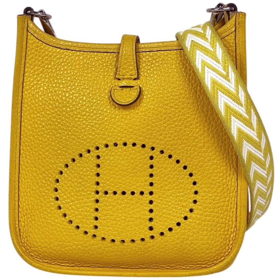 Hermes Evelyne TPM Amazon Pochette Mini Perforated Shoulder Bag in Taurillon Clemence Leather, Jaune: --- Catalog ---Category: SizeStrap Drop: 59cm / 23.22''Size (HxWxD): 17cm x 16.5cm x 5.5cm / 6.69'' x 6.49'' x 2.16''Category: DesignType: Pochette, Shoulder bagGender: WomenMaterial: Taurillon clemen