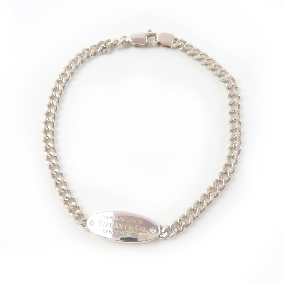 TIFFANY&Co. Tiffany & Co. Return to Oval I.D. Bracelet, Ag925 Sterling Silver, Diamond, Curb Chain,: --- Catalog ---Category: SizeLength: 16.5cm / 6.49''Category: DesignType: Charm braceletColor: SilverStone: DiamondGender: WomenMaterial: Silver 925Category: GeneralBrand: Tiffany--- Item List ---Sect