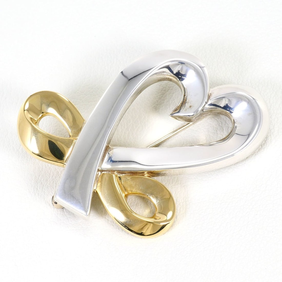 Tiffany & Co. Loving Heart 18K Yellow Gold Silver Brooch, Total Weight 15.7g, Jewelry: --- Catalog ---Category: SizeSize (HxWxD): 4cm x 3cm / 1.57'' x 1.18''Category: DesignType: BroochColor: Silver, Yellow goldGender: WomenMaterial: Silver 925, Yellow gold (18K)Category: GeneralBrand: 