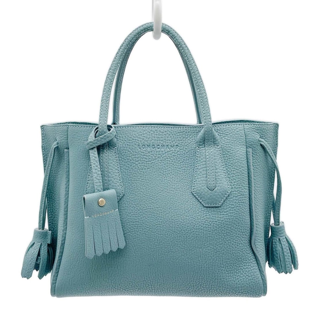 Longchamp Penelope Tassel Handbag Tote Leather Blue Women's: --- Catalog ---Category: SizeSize (HxWxD): 24cm x 28cm x 13cm / 9.44'' x 11.02'' x 5.11''Category: DesignType: HandbagColor: BlueGender: WomenMaterial: Leather Category: GeneralMPN: KB-007Brand: Longc