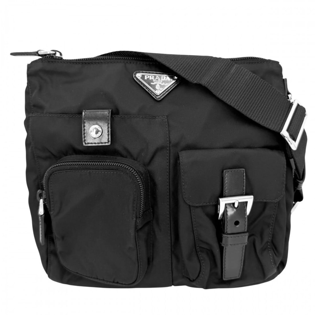 Prada waist bag for men and women, featuring a triangle logo. This pouch/body can be worn over the: --- Catalog ---Category: SizeSize (HxWxD): 22cm x 23cm x 4cm / 8.66'' x 9.05'' x 1.57''Category: DesignType: Fanny pack, Pouch, Sling bagColor: BlackGender: Men,WomenMaterial: Nylon , Leather Category