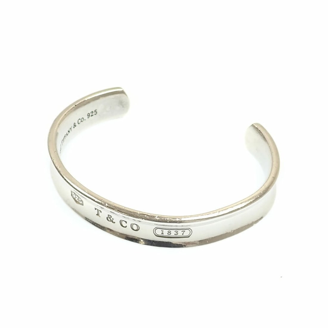 Tiffany & Co. Narrow Bangle, Women's, SV925, 38.2g, Silver Bracelet: --- Catalog ---Category: SizeLength: 18cm / 7.08''Category: DesignType: BangleGender: WomenMaterial: Silver 925Category: GeneralBrand: Tiffany--- Item List ---Section: ConditionRanking: Rank AB Used -