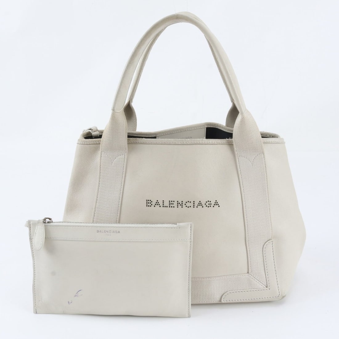 Balenciaga Navy Cabas Perforated Logo Handbag with Pouch 002123 Leather Tote Bag for Women: --- Catalog ---Category: SizeSize (HxWxD): 24cm x 30cm x 16cm / 9.44'' x 11.81'' x 6.29''Handle Length: 42cm / 16.53''Category: DesignType: Handbag, Tote bagColor: WhiteGender: WomenMaterial: Leather 