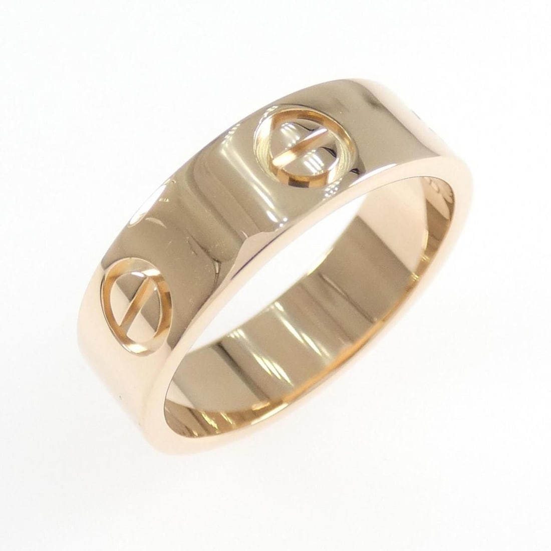 Cartier Love Ring: --- Catalog ---Category: SizeUS Size: 6.5Brand Size: 52Category: DesignType: Band ringGender: WomenMaterial: Pink gold (18K)Category: GeneralBrand: Cartier--- Item List ---Section: ConditionRanking: R