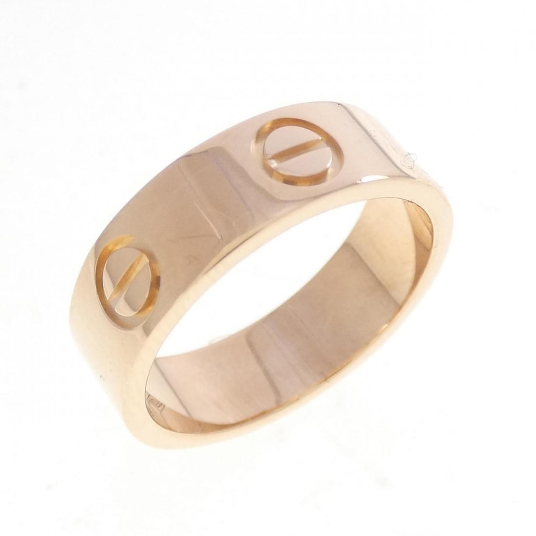 Cartier Love Ring: --- Catalog ---Category: SizeUS Size: 5.5Brand Size: 50Category: DesignType: Band ringGender: WomenMaterial: Pink gold (18K)Category: GeneralBrand: Cartier--- Item List ---Section: ConditionRanking: R