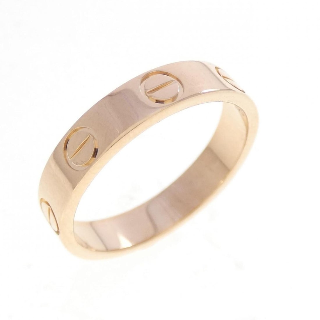 Cartier Mini Love Ring: --- Catalog ---Category: SizeUS Size: 4.5Brand Size: 48Category: DesignType: Band ringGender: WomenMaterial: Pink gold (18K)Category: GeneralBrand: Cartier--- Item List ---Section: ConditionRanking: