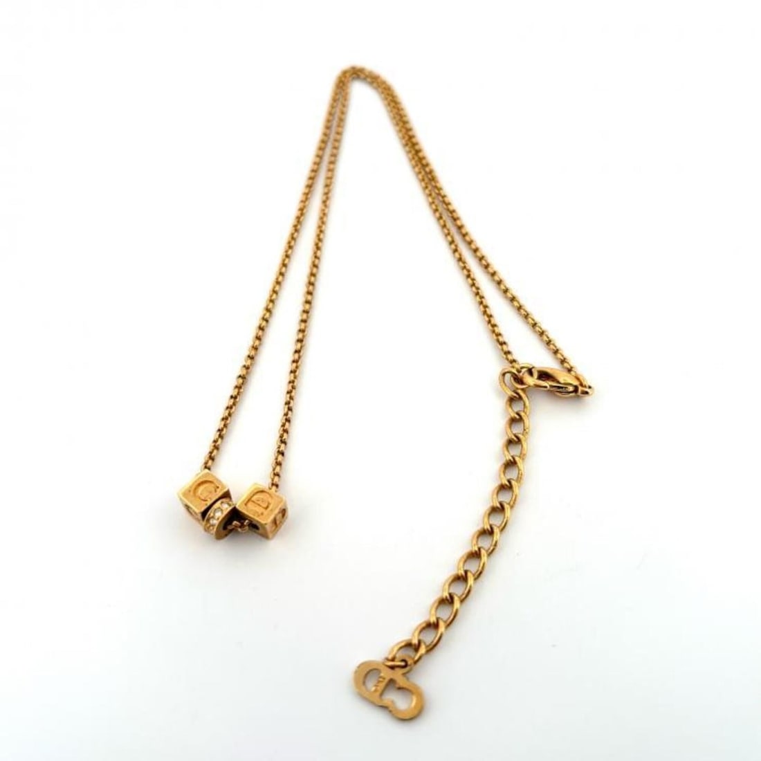 Christian Dior necklace, cube logo, CD design, rhinestones, gold plated.: --- Catalog ---Category: SizePendant Size: 5mm x 12mm / 0.19'' x 0.47''Neck Circumference: 42 cm / 16.53''Category: DesignColor: GoldGender: WomenMaterial: Gold plating, RhinestoneNecklace Type: Neckl