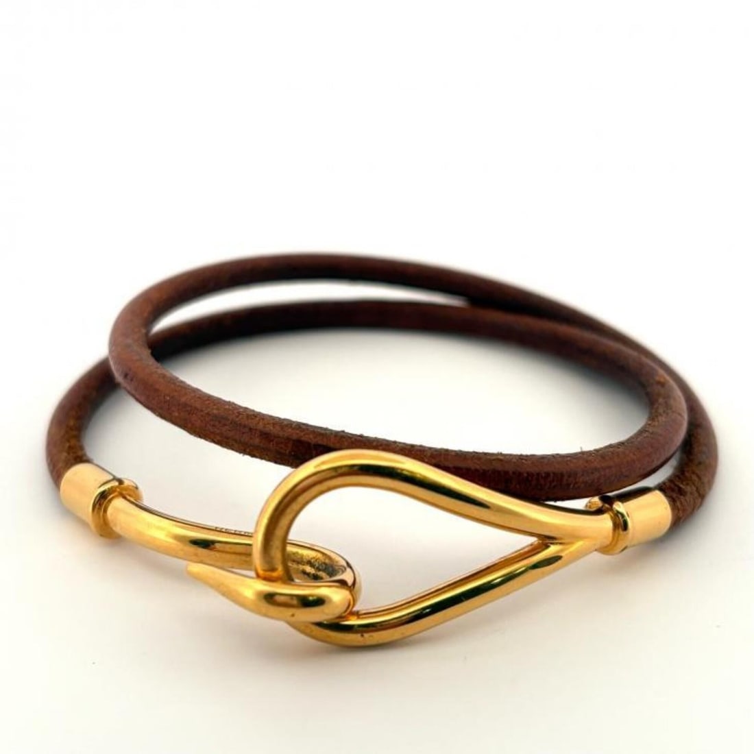 Hermes Jumbo Metal Gold Leather Choker Bracelet: --- Catalog ---Category: SizeTotal Length: 38cm / 14.96''Category: DesignType: Charm braceletColor: Brown, GoldGender: WomenMaterial: Leather, MetalCategory: GeneralBrand: Hermes--- Item List ---Secti